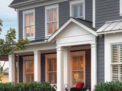 Two story, mid-class home with dark gray James Hardie siding
