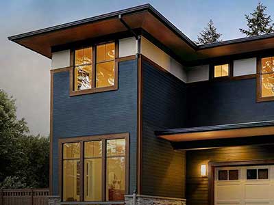 Modern two-story, mid-class home with dark blue siding