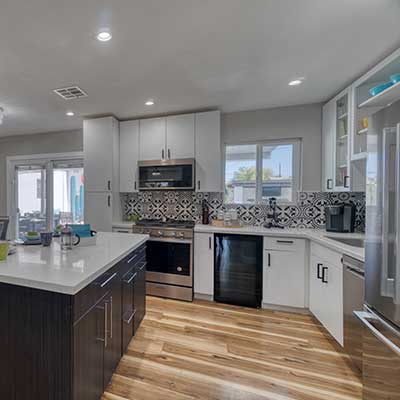 Modern gray kitchen remodel with an island countertop